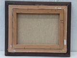 an old picture frame is sitting on a table with a white background