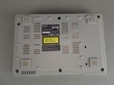 a close up of a white electronic device on a table