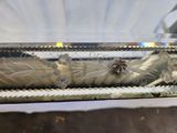 a glass box that has a flower design on it