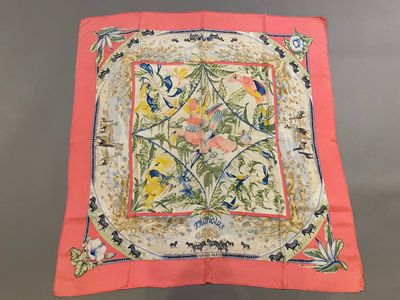 a pink and yellow square with a floral design on it