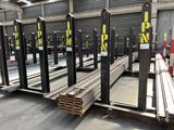 many steel beams stacked up in a warehouse