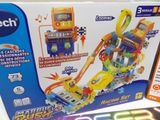 a box with a toy set on it and a remote control