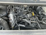 a picture of a car ' s engine with its hood open