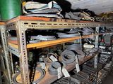many different types of belts on a shelf in a room