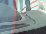 a reflection of a car in the window of a vehicle