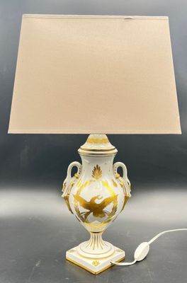 a lamp that is sitting on a table with a lamp on it