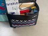 a black bag with a lot of things inside of it