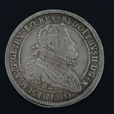 a close up of a silver coin with a picture of a man on it