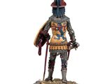 statue of a knight with a sword and shield on a wooden base