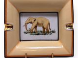 a picture of an elephant painted on the side of a ashtray
