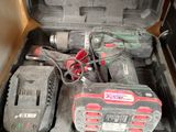 a tool box with tools in it sitting on the floor