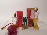 a bottle of perfume, a bottle of perfume and a box of perfume