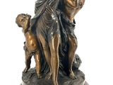 an image of a bronze statue of two women and a dog