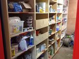 a room filled with lots of paint and supplies