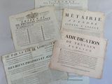 several old newspapers are stacked on top of each other on a table
