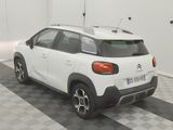 a white car that is parked in a garage