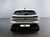 the rear end of a white car in a white room
