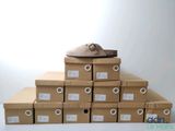 a pile of boxes with shoes on top of them