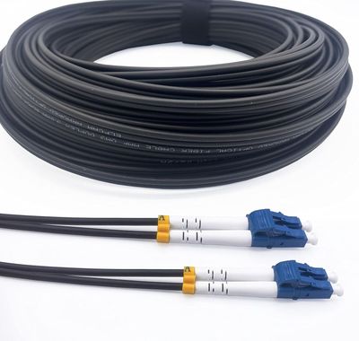 a close up of three black and white cables on a white surface