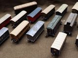 a lot of toy trains that are sitting on the floor