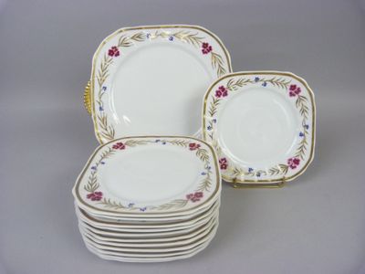 six pieces of porcelain plates with floral designs on them