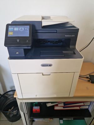a printer that is sitting on top of a cabinet