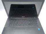 an open laptop computer sitting on top of a white surface