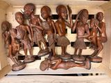 carvings in a wooden box on a table in a room