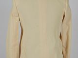 the back view of a beige jacket on a mannequin mannequin mannequin mannequin mannequin mannequin mannequin manne