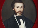 portrait of a man in a tuxedo with a beard and a bow tie