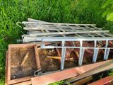 a pile of wood sitting on the ground in the grass