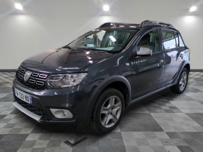 a picture of a grey dacia parked on a checkered floor