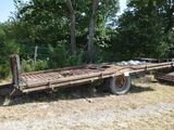 a trailer that is sitting in the middle of a field