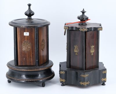 pair of asian style wooden boxes with metal decorations on stands