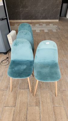 three chairs that are sitting on a wooden floor