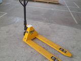 the forklift is sitting on the concrete floor in the warehouse