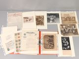 an assortment of old photographs and postcards on display on a table