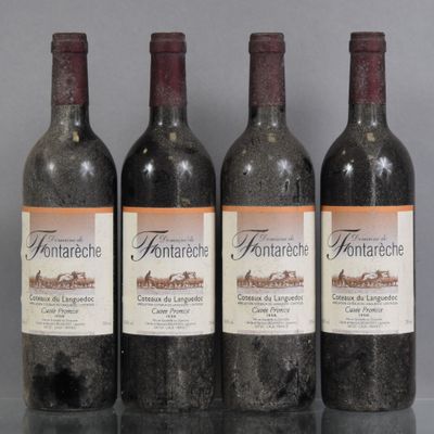 three bottles of wine are lined up on a table