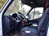 a white van with black seats and a steering wheel