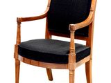 a black chair with a wooden frame and black seat
