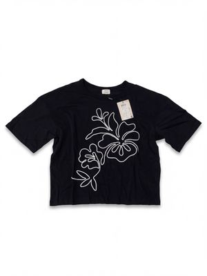 a black t - shirt with white flowers on it