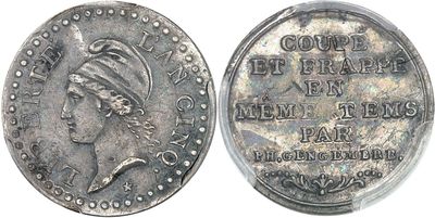 a close up of a coin with a woman ' s head on it