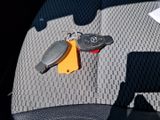 a car key and a car keychain on the seat of a car