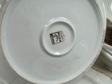 a white plate with a black and white picture on it