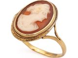 an image of a gold ring with a carved cameo of a woman
