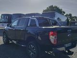 a black pickup truck parked in a parking lot