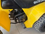 a close up of a yellow motorcycle with a black seat