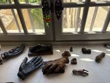 a table with a lot of gloves and other items on it