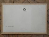 an old photo of a ring on a piece of paper