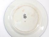 a white plate with a picture of a man on it